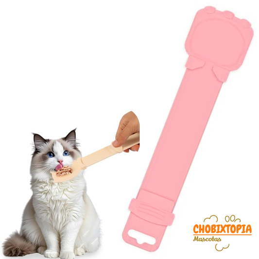 CUCHARA DISPENSADOR EXPRIMIBLE CON TIRA PARA COMIDA HUMEDA DE GATOS ROSA